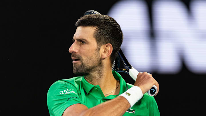 Feb 01, 2026; Melbourne, Victoria, Australia; Novak Djokovic of Serbia in action against Carlos Alcaraz of Spain in the final of the menís singles at the Australian Open at Rod Laver Arena in Melbourne Park. Mandatory Credit: Mike Frey-Imagn Images