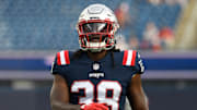 Aug 11, 2022; Foxborough, Massachusetts, USA; New England Patriots running back Rhamondre Stevenson (38) warms up  warms up before a preseason game against the New York Giants at Gillette Stadium. Mandatory Credit: Eric Canha-Imagn Images
