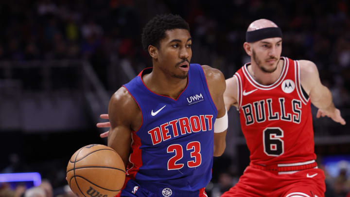Apr 11, 2024; Detroit, Michigan, USA;  Detroit Pistons guard Jaden Ivey (23) dribbles on Chicago Bulls guard Alex Caruso (6) in the first half at Little Caesars Arena. Mandatory Credit: Rick Osentoski-USA TODAY Sports