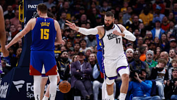 Mar 5, 2025; Denver, Colorado, USA; Sacramento Kings center Jonas Valanciunas (17) reacts after a play as Denver Nuggets center Nikola Jokic (15) looks on in the second quarter at Ball Arena. Mandatory Credit: Isaiah J. Downing-Imagn Images