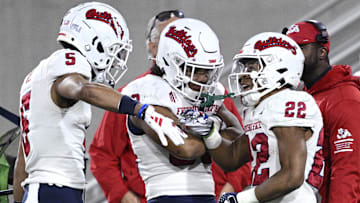 Nov 25, 2023; San Diego, California, USA; Fresno State Bulldogs running back Malik Sherrod (22) celebrates with wide receiver Jaelen Gill (5) after scoring a touchdown during the first half against the San Diego State Aztecs at Snapdragon Stadium. Mandatory Credit: Orlando Ramirez-Imagn Images