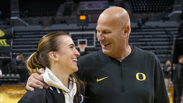 Former Duck Sabrina Ionescu, left, meets Oregon women's basketball coach Kelly Graves after the Duck's exhibition game