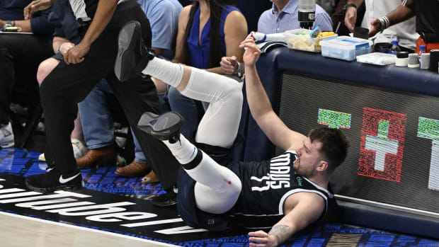 Jun 12, 2024; Dallas, Texas, USA; Dallas Mavericks guard Luka Doncic (77) falls during the fourth quarter in game three of the 2024 NBA Finals against the Boston Celtics at American Airlines Center. Mandatory Credit: Jerome Miron-USA TODAY Sports