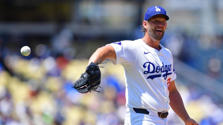 Jul 25, 2024; Los Angeles, California, USA; Los Angeles Dodgers starting pitcher Clayton Kershaw (22) receives the ball before throwing against the San Francisco Giants during the fourth inning at Dodger Stadium. Mandatory Credit: Gary A. Vasquez-USA TODAY Sports