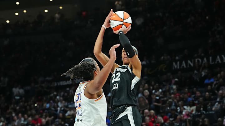Oct 3, 2025; Las Vegas, Nevada, USA; Las Vegas Aces center A'ja Wilson (22) shoots against Phoenix Mercury forward Alyssa Thomas (25) during the fourth quarter of game one of the 2025 WNBA Finals at Michelob Ultra Arena. Mandatory Credit: Stephen R. Sylvanie-Imagn Images Oct 3, 2025; Las Vegas, Nevada, USA; Las Vegas Aces center A'ja Wilson (22) shoots against Phoenix Mercury forward Alyssa Thomas (25) during the fourth quarter of game one of the 2025 WNBA Finals at Michelob Ultra Arena. Mandatory Credit: Stephen R. Sylvanie-Imagn Images