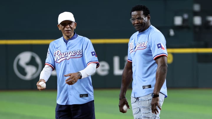 Jun 18, 2024; Arlington, Texas, USA; NFL Hall of Famers Drew Pearson (L) and Michael Irvin (R) throw out the first pitch before the game between the New York Mets and the Texas Rangers at Globe Life Field.