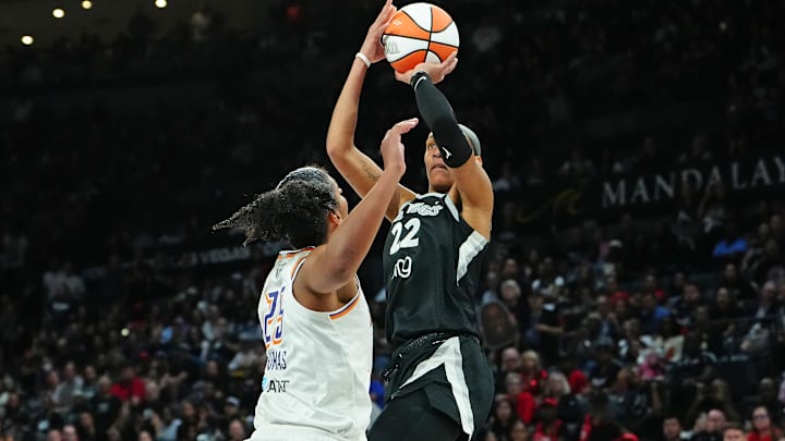 Oct 3, 2025; Las Vegas, Nevada, USA; Las Vegas Aces center A'ja Wilson (22) shoots against Phoenix Mercury forward Alyssa Thomas (25) during the fourth quarter of game one of the 2025 WNBA Finals at Michelob Ultra Arena. Mandatory Credit: Stephen R. Sylvanie-Imagn Images Oct 3, 2025; Las Vegas, Nevada, USA; Las Vegas Aces center A'ja Wilson (22) shoots against Phoenix Mercury forward Alyssa Thomas (25) during the fourth quarter of game one of the 2025 WNBA Finals at Michelob Ultra Arena. Mandatory Credit: Stephen R. Sylvanie-Imagn Images