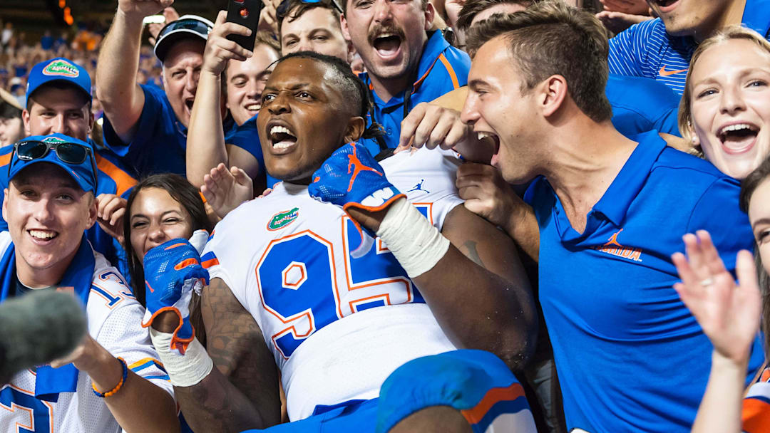 Sep 22, 2018; Knoxville, TN, USA; Florida Gators defensive lineman Adam Shuler II (95) celebrates with fans after defeating the Tennessee Volunteers 47-21 at Neyland Stadium. Mandatory Credit: Bryan Lynn-Imagn Images