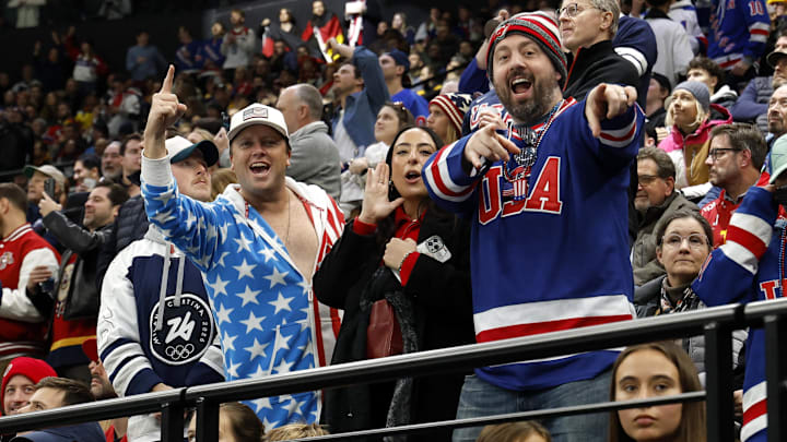 Feb 15, 2026; Milan, Italy; United States fans react in the stands during the match against Germany in men's ice hockey group C play during the Milano Cortina 2026 Olympic Winter Games at Milano Santagiulia Ice Hockey Arena. Mandatory Credit: Geoff Burke-Imagn Images