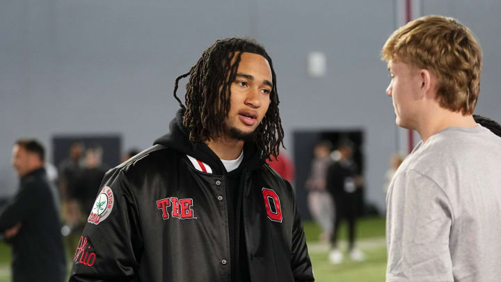 Mar 20, 2024; Columbus, Ohio, USA; Houston Texans quarterback CJ Stroud talks to Ohio State Buckeyes quarterback Devin Brown during Pro Day at the Woody Hayes Athletic Center.