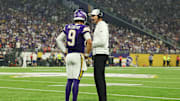 Sep 14, 2025; Minneapolis, Minnesota, USA; Minnesota Vikings quarterback J.J. McCarthy (9) speaks with Minnesota Vikings head coach Kevin O'Connell during the first half against the Atlanta Falcons at U.S. Bank Stadium. Mandatory Credit: Matt Krohn-Imagn Images