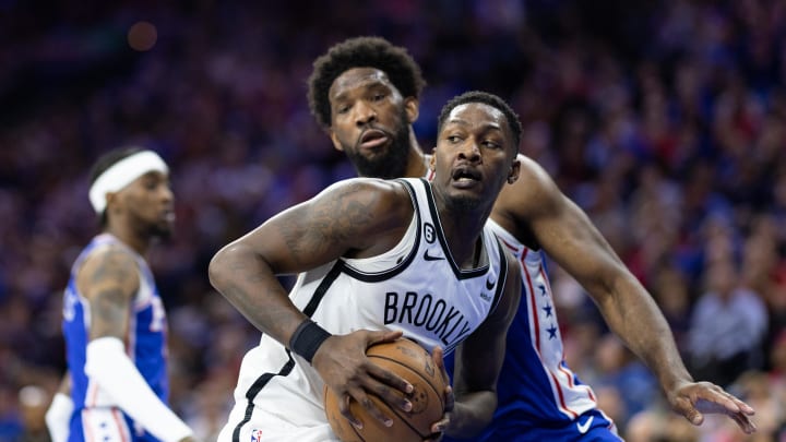 Apr 17, 2023; Philadelphia, Pennsylvania, USA; Brooklyn Nets forward Dorian Finney-Smith (28) controls the ball in front of Philadelphia 76ers center Joel Embiid (21) during the first quarter in game two of the 2023 NBA playoffs at Wells Fargo Center. Mandatory Credit: Bill Streicher-USA TODAY Sports