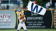 South Bend Cubs mascot Stu waves the winning flag after a minor league baseball game against the Lake County Captains at Four Winds Field on Friday, June 21, 2024, in South Bend.