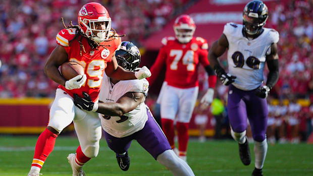 Kansas City Chiefs running back Kareem Hunt runs against Baltimore Ravens defensive tackle Aeneas Peebles in Week 4.
