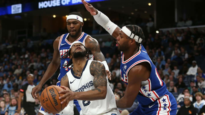 Apr 6, 2024; Memphis, Tennessee, USA; Memphis Grizzlies guard Zavier Simpson (2) handles the ball as Philadelphia 76ers guard Buddy Hield (17) defends during the second half at FedExForum. Mandatory Credit: Petre Thomas-USA TODAY Sports