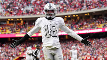 Dec 25, 2023; Kansas City, Missouri, USA; Las Vegas Raiders cornerback Jack Jones (18) interacts with then crowd during the second half against the Kansas City Chiefs at GEHA Field at Arrowhead Stadium. Mandatory Credit: Jay Biggerstaff-Imagn Images