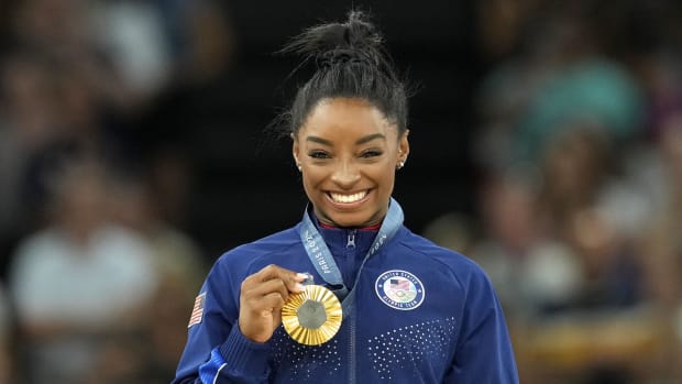 Simone Biles celebrates a gold medal at Paris Olympics