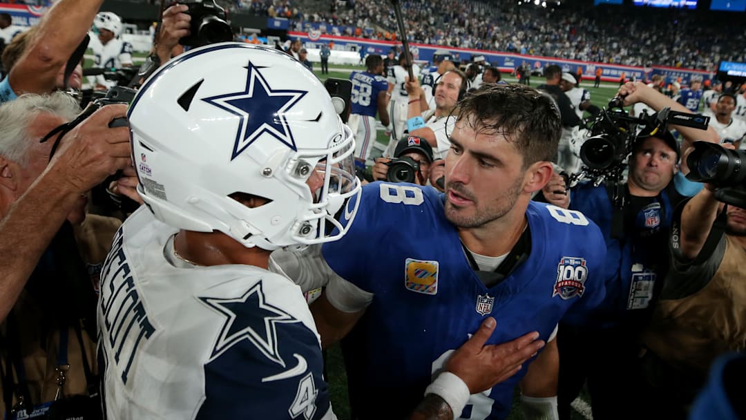 Sep 26, 2024; East Rutherford, New Jersey, USA; Dallas Cowboys quarterback Dak Prescott (4) and New York Giants quarterback Daniel Jones (8) meet after their game at MetLife Stadium. 