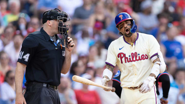 Jun 29, 2024; Philadelphia, Pennsylvania, USA; Philadelphia Phillies outfielder Nick Castellanos (8) argues with home plate umpire Nate Tomlinson (114) after a called third strike to end the eighth inning against the Miami Marlins at Citizens Bank Park. Mandatory Credit: Bill Streicher-USA TODAY Sports