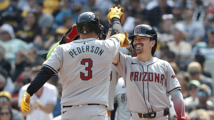 Aug 4, 2024; Pittsburgh, Pennsylvania, USA;  Arizona Diamondbacks right fielder Corbin Carroll (right) greets designated hitter Joc Pederson (3) crossing home plate on a three run home run against the Pittsburgh Pirates during the seventh inning at PNC Park. Mandatory Credit: Charles LeClaire-USA TODAY Sports