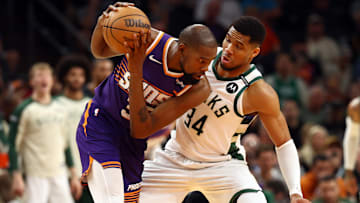 Mar 24, 2025; Phoenix, Arizona, USA; Milwaukee Bucks forward Giannis Antetokounmpo (34) defends against Phoenix Suns forward Kevin Durant (35) at Footprint Center. Mandatory Credit: Mark J. Rebilas-Imagn Images