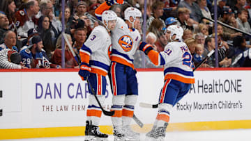 Oct 14, 2024; Denver, Colorado, USA; New York Islanders center Brock Nelson (29) celebrates his goal with defenseman Adam Pelech (3) and center Kyle Palmieri (21) in the second period against the Colorado Avalanche at Ball Arena. Mandatory Credit: Isaiah J. Downing-Imagn Images