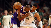 Milwaukee Bucks forward Giannis Antetokounmpo defends against Phoenix Suns forward Kevin Durant. 