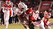 Mississippi State Bulldogs wide receiver Anthony Evans III (3) scores a touchdown during the fourth quarter against the Arkansas Razorbacks at Donald W. Reynolds Razorback Stadium. Bulldogs won 38-35.