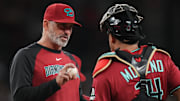 Arizona Diamondbacks manager Torey Lovullo talks to catcher Gabriel Moreno (14) during their game against the Seattle Mariners at Chase Field in Phoenix, on June 10, 2025.