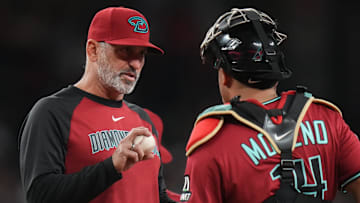 Arizona Diamondbacks manager Torey Lovullo talks to catcher Gabriel Moreno (14) during their game against the Seattle Mariners at Chase Field in Phoenix, on June 10, 2025.