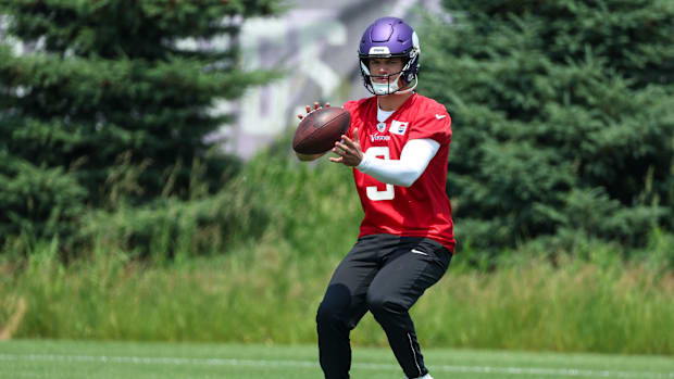 Minnesota Vikings quarterback J.J. McCarthy (9) practices during minicamp
