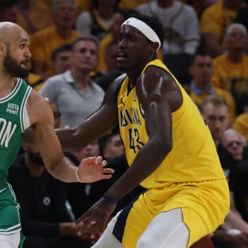 May 25, 2024; Indianapolis, Indiana, USA; Boston Celtics guard Derrick White (9) controls the ball against Indiana Pacers forward Pascal Siakam (43) during the first quarter of game three of the eastern conference finals in the 2024 NBA playoffs at Gainbridge Fieldhouse. Mandatory Credit: Trevor Ruszkowski-USA TODAY Sports