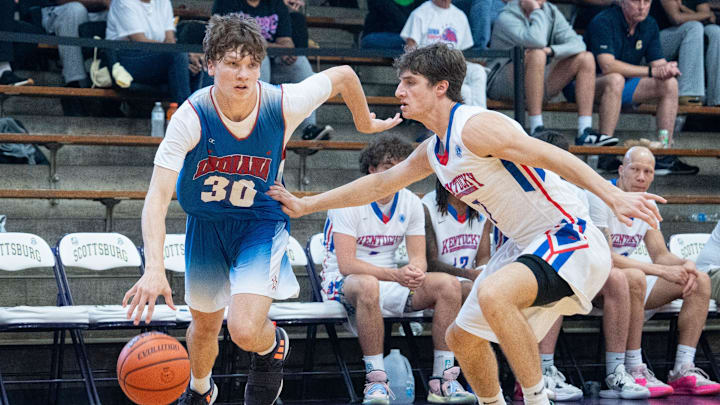 Indiana Junior All-Star Braylon Mullins (30) makes his way to the basket around Kentucky Junior All-Star Zander Carter (7) during their game on Sunday, June 2, 2024 in Scottsburg, Ind. at Charles E. Meyer Gymnasium for the first game of the Indiana vs Kentucky All-Stars basketball week.