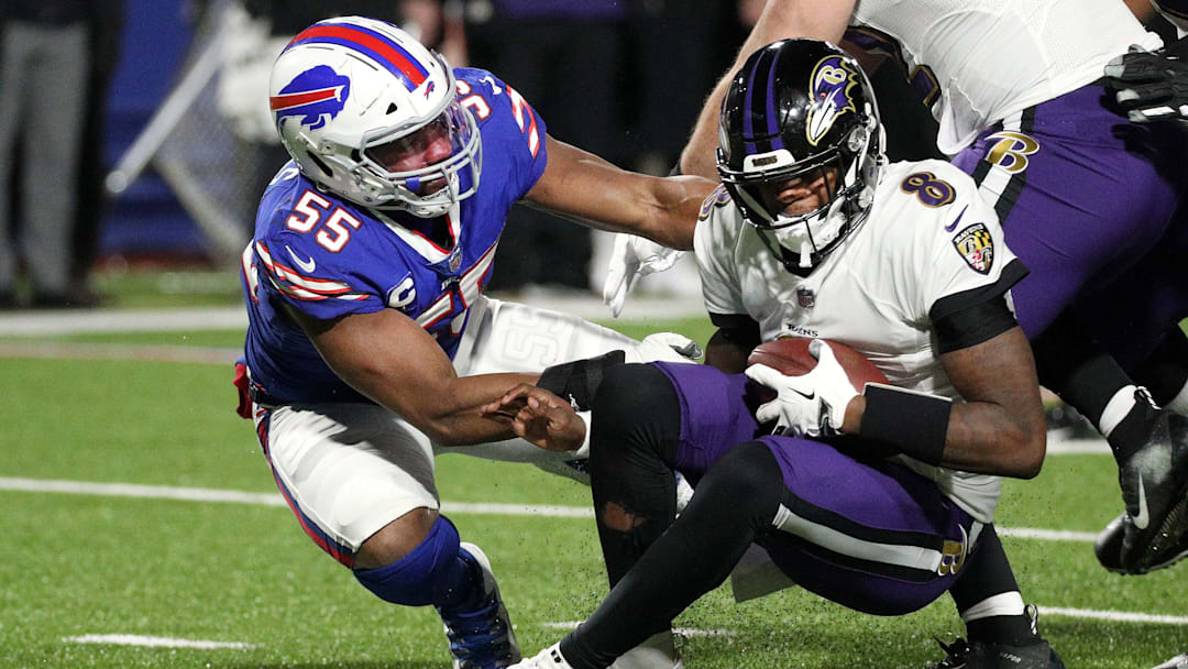 Bills Jerry Hughes gets the sack on Ravens quarterback Lamar Jackson.  Jackson was sacked three times before leaving the game with an injury.