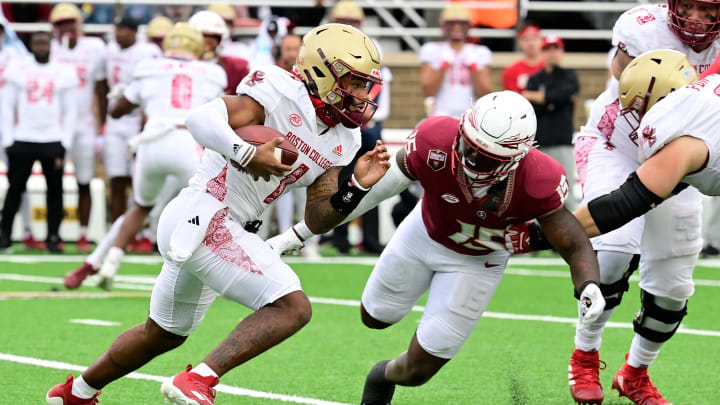 Sep 16, 2023; Chestnut Hill, Massachusetts, USA; Boston College Eagles quarterback Thomas Castellanos (1) runs the ball as Florida State Seminoles linebacker Tatum Bethune (15) closes in during the second half at Alumni Stadium. Mandatory Credit: Eric Canha-USA TODAY Sports