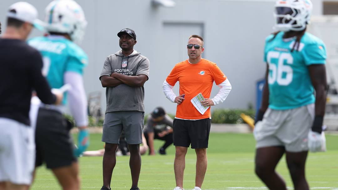 Miami Dolphins head coach Jeff Hafley watches a minicamp practice with defensive quality control coach Siriki Diabate at the Baptist Health Training Complex.