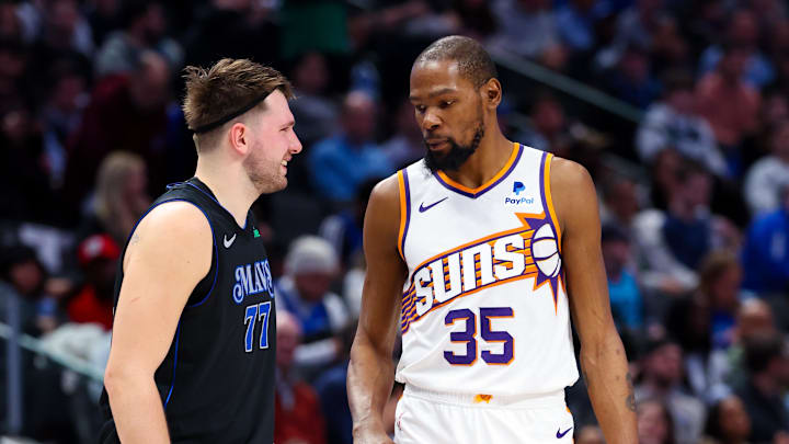 Jan 24, 2024; Dallas, Texas, USA;  Dallas Mavericks guard Luka Doncic (77) laughs with Phoenix Suns forward Kevin Durant (35) during the second half at American Airlines Center. Mandatory Credit: Kevin Jairaj-Imagn Images