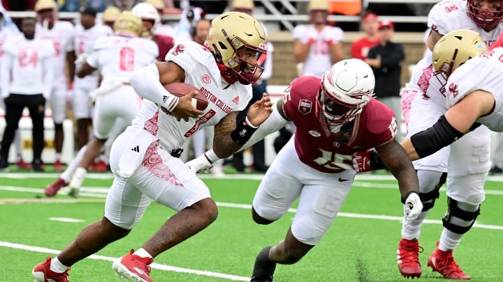 Sep 16, 2023; Chestnut Hill, Massachusetts, USA; Boston College Eagles quarterback Thomas Castellanos (1) runs the ball as Florida State Seminoles linebacker Tatum Bethune (15) closes in during the second half at Alumni Stadium. Mandatory Credit: Eric Canha-USA TODAY Sports