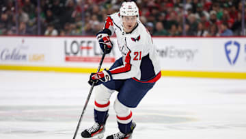 Mar 27, 2025; Saint Paul, Minnesota, USA; Washington Capitals center Aliaksei Protas (21) skates with the puck against the Minnesota Wild during the second period at Xcel Energy Center. Mandatory Credit: Matt Krohn-Imagn Images