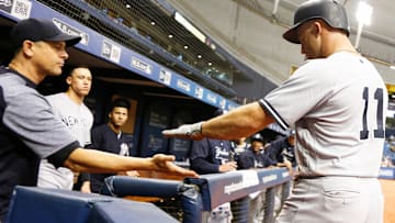 New York Yankees center fielder Brett Gardner is congratulated by New York Yankees manager Aaron Boone.