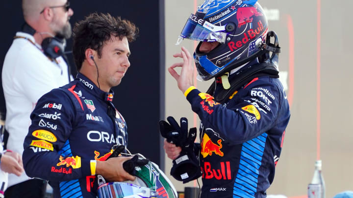 May 4, 2024; Miami Gardens, Florida, USA; Red Bull Racing driver Sergio Perez (11) and Red Bull Racing driver Max Verstappen (1) talks after Verstappen qualified P1 for the Miami Grand Prix at Miami International Autodrome. Mandatory Credit: John David Mercer-USA TODAY Sports