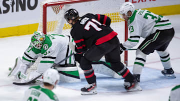 sFeb 22, 2024; Ottawa, Ontario, CAN; Dallas Stars goalie Scott Wedgewood (41) makes a save in front of Ottawa Senators center Ridly Greig (71) in the third period at the Canadian Tire Centre. Mandatory Credit: Marc DesRosiers-Imagn Images
