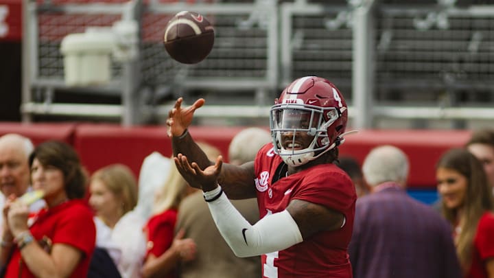 Aug 31, 2024; Tuscaloosa, Alabama, USA; Alabama Crimson Tide quarterback Jalen Milroe (4) practices on the field during warm ups at Bryant-Denny Stadium. Mandatory Credit: Will McLelland-Imagn Images