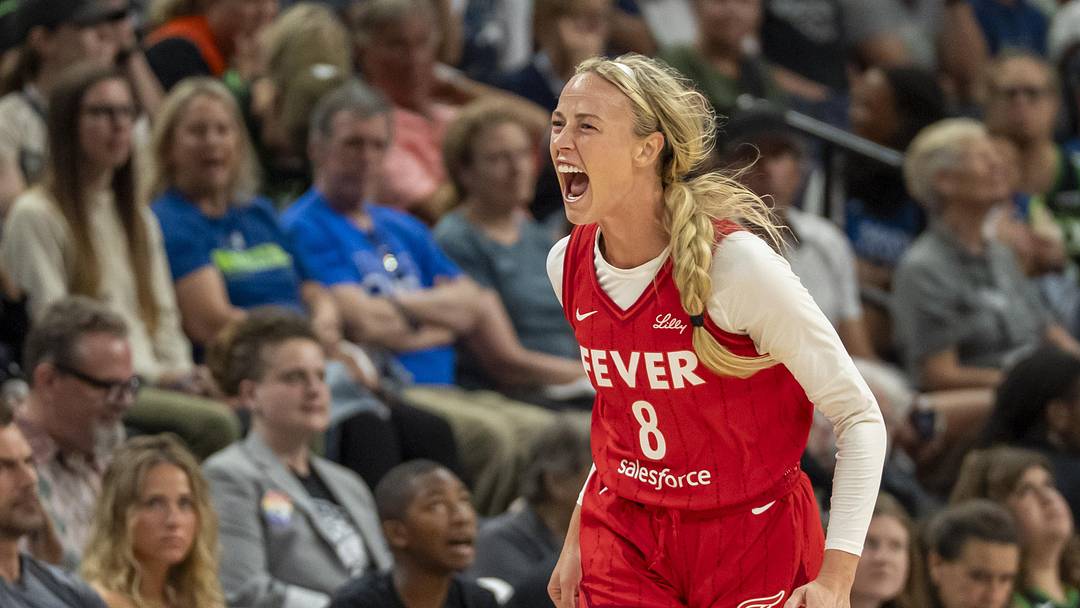 Jul 1, 2025; Minneapolis, Minnesota, USA; Indiana Fever guard Sophie Cunningham (8) celebrates after making a three point shot against the Minnesota Lynx in the second half during the Commissioner's Cup final at Target Center. 