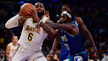 Jan 2, 2022; Los Angeles, California, USA; Los Angeles Lakers forward LeBron James (6) moves to the basket against Minnesota Timberwolves guard Patrick Beverley (22) during the second half at Crypto.com Arena. Mandatory Credit: Gary A. Vasquez-Imagn Images