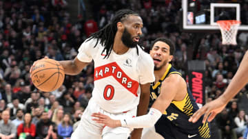 Apr 9, 2024; Toronto, Ontario, CAN;   Toronto Raptors guard Javon Freeman-Liberty (0) dribbles the ball past Indiana Pacers guard Tyrese Haliburton (0) in the first half at Scotiabank Arena. Mandatory Credit: Dan Hamilton-USA TODAY Sports