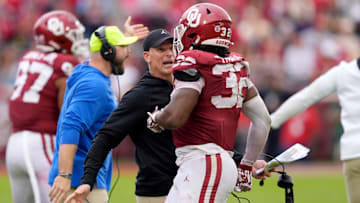 Oklahoma coach Brent Venables talks with Sooners defensive lineman R Mason Thomas (32) during a college football game between the Sooners and Ole Miss at Gaylord Family — Oklahoma Memorial Stadium in Norman on Oct. 25.