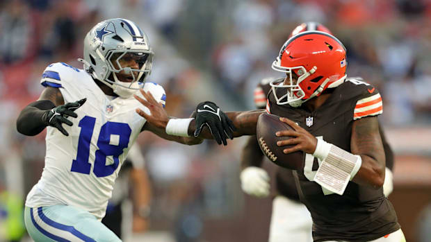 Cleveland Browns quarterback Deshaun Watson (4) runs for yards against Dallas Cowboys linebacker Damone Clark (18) during the