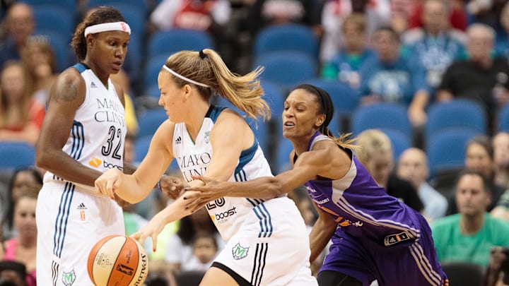 Jun 27, 2015; Minneapolis, MN, USA; Phoenix Mercury guard DeWanna Bonner (24) tries to steal the ball from Minnesota Lynx guard Tricia Liston (20) in the second quarter at Target Center. Mandatory Credit: Brad Rempel-Imagn Images