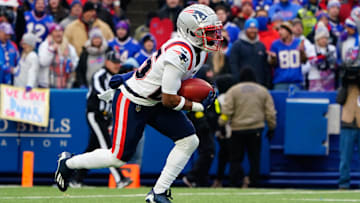 Jan 8, 2023; Orchard Park, New York, USA; New England Patriots cornerback Marcus Jones (25) returns a kick off against the Buffalo Bills during the first half at Highmark Stadium. Mandatory Credit: Gregory Fisher-USA TODAY Sports